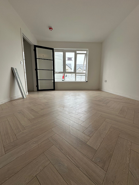 Premium herringbone wood flooring installation in modern room